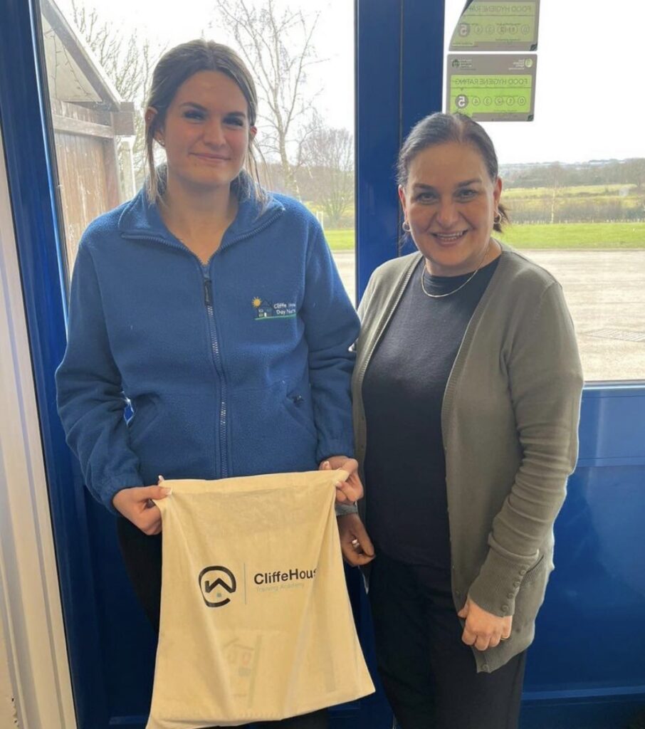A Level 2 apprentice with her manager